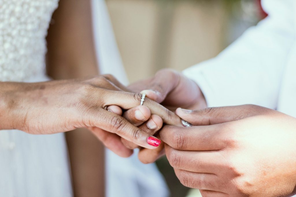 Hands exchanging a ring